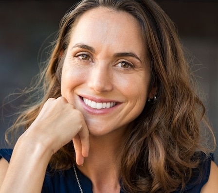Woman smiling with radiant skin after PRF treatment for natural facial rejuvenation
