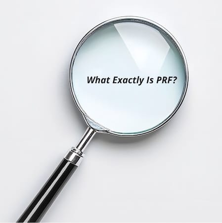 Magnifying glass with text What Exactly Is PRF, representing platelet-rich fibrin treatment overview