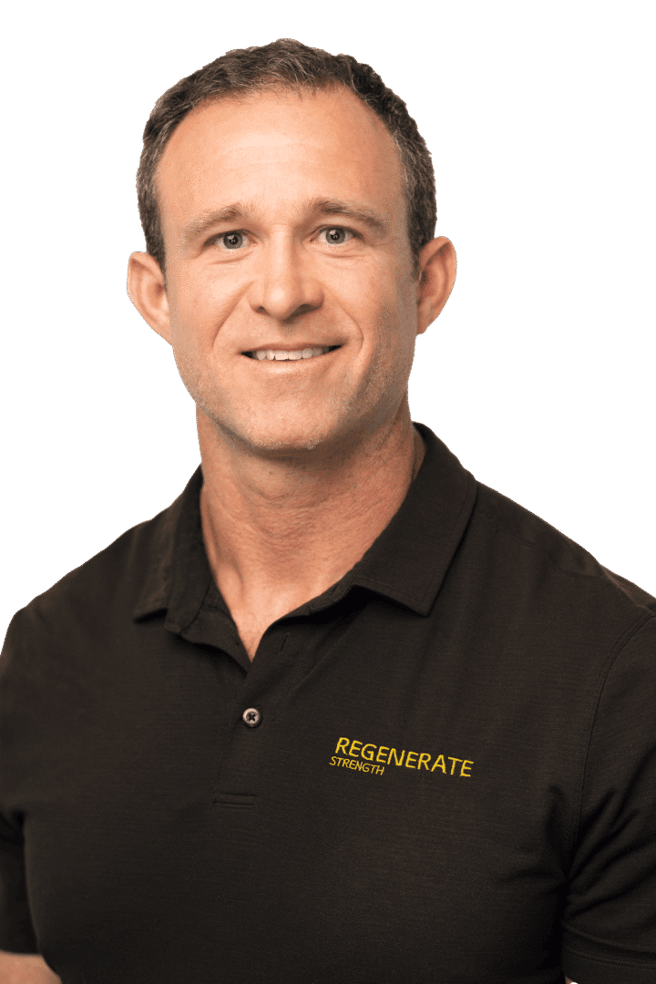 Male provider in black Regenerate Health Medical Center uniform smiling in vertical headshot.