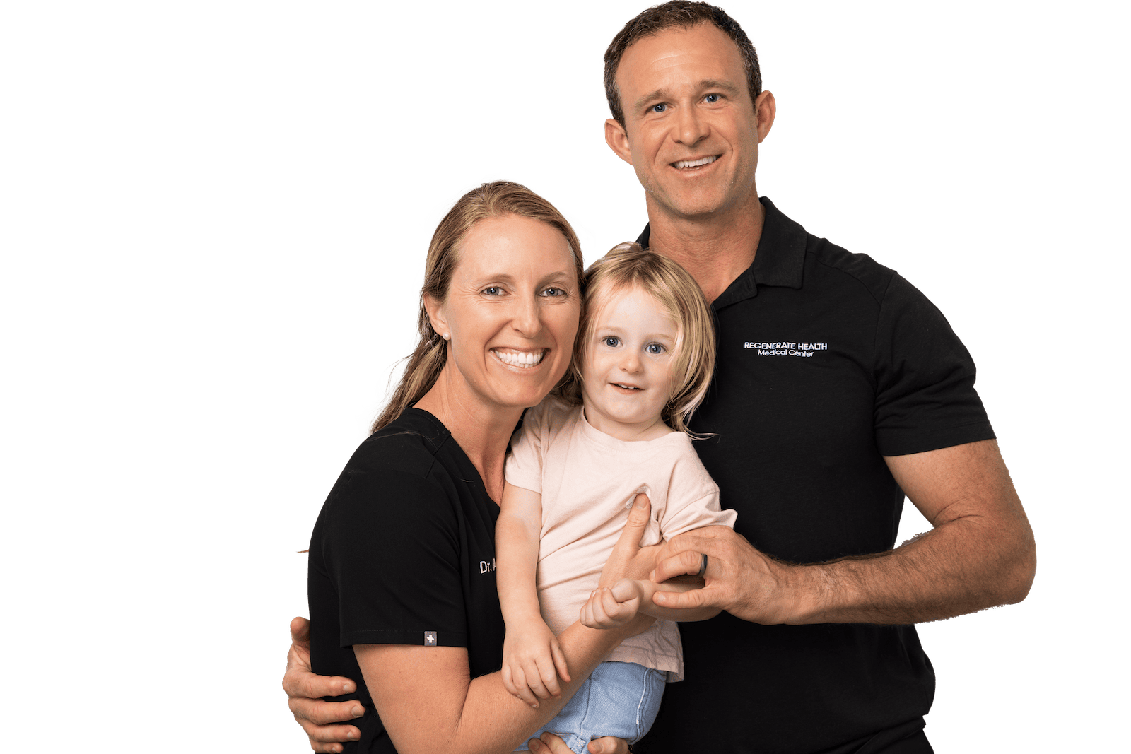 Two adults in RHMC uniforms holding a small child, smiling in a family portrait.