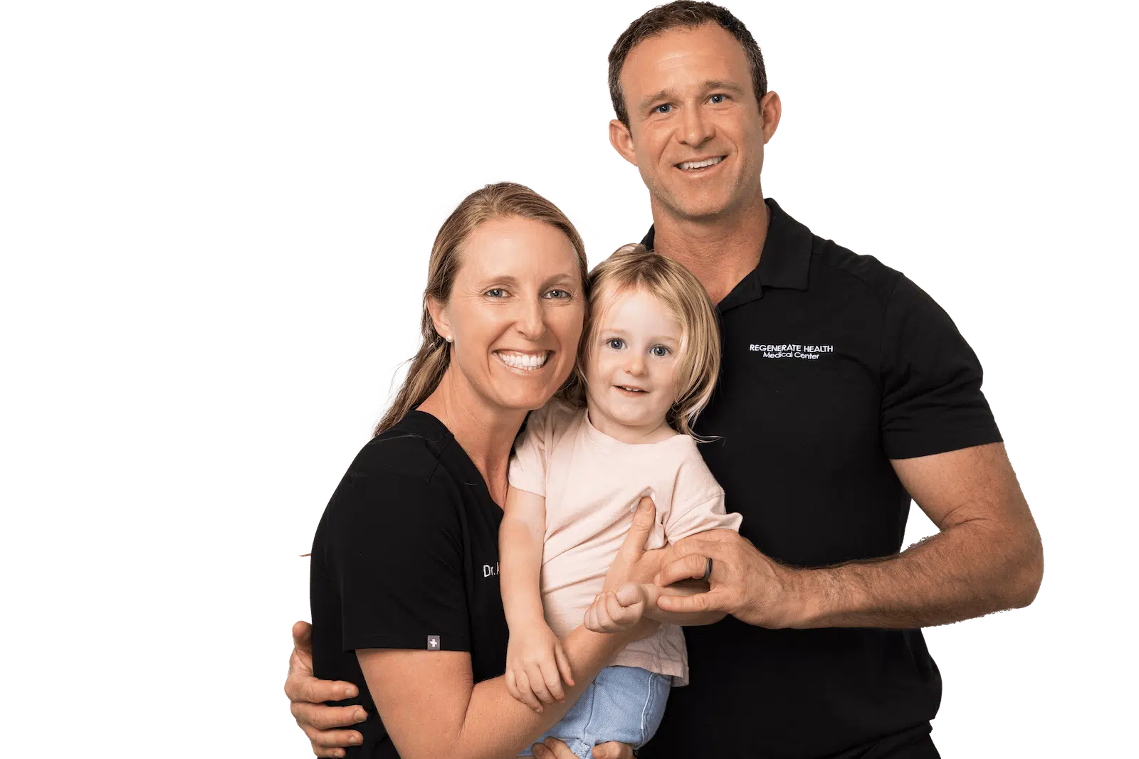 Two adults in RHMC uniforms holding a small child, smiling in a family portrait.