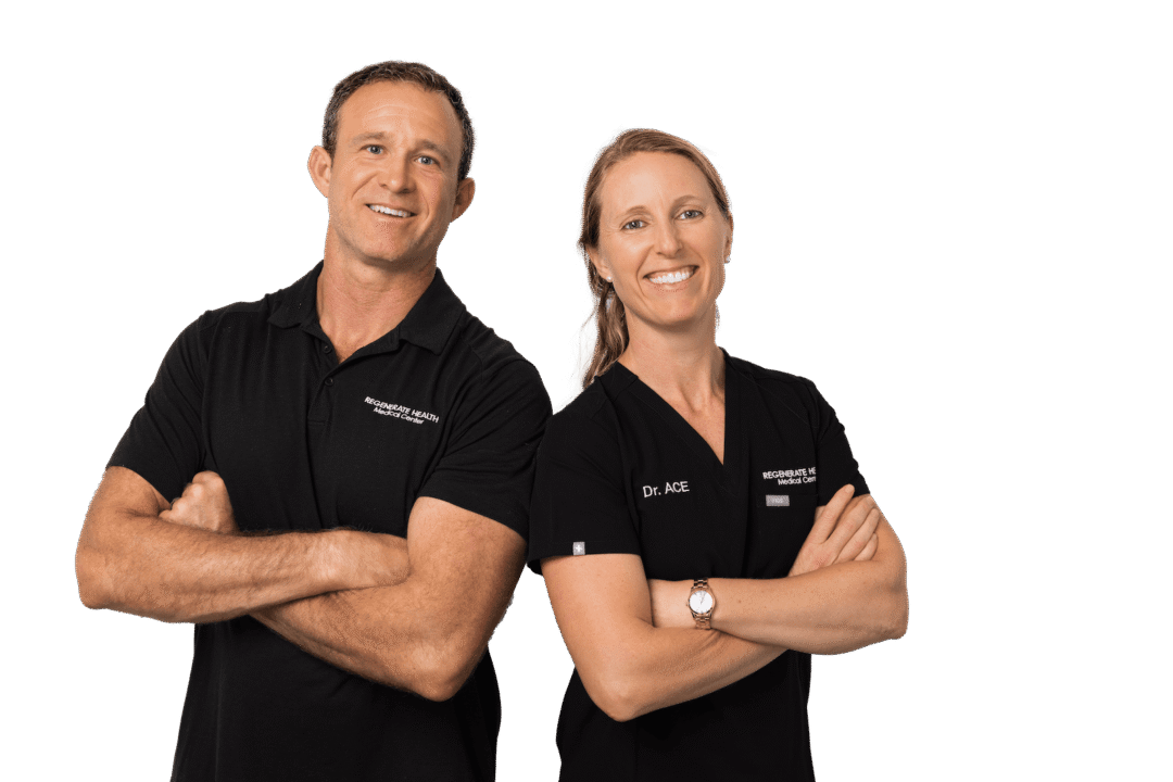 Two medical practitioners in black RHMC uniforms smiling in a horizontal team portrait