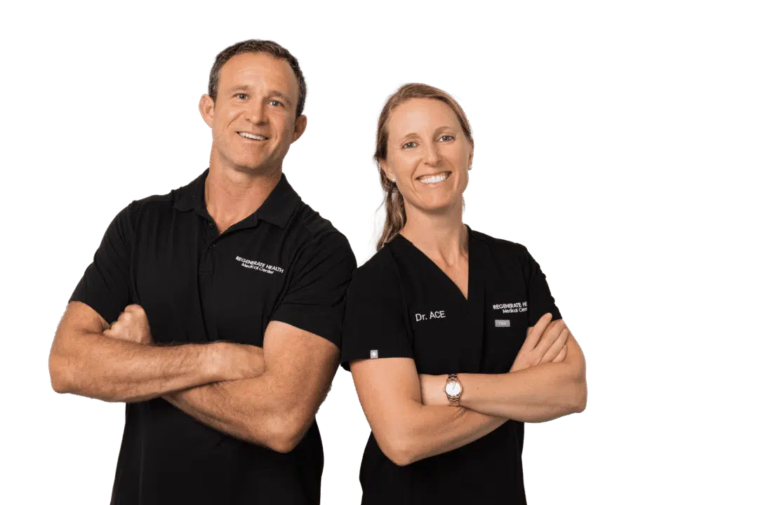 Two medical practitioners in black RHMC uniforms smiling in a horizontal team portrait