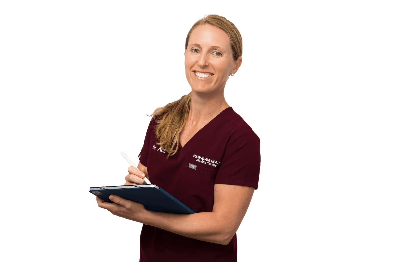 Female practitioner in burgundy scrubs smiling in professional horizontal portrait with a tablet her hands