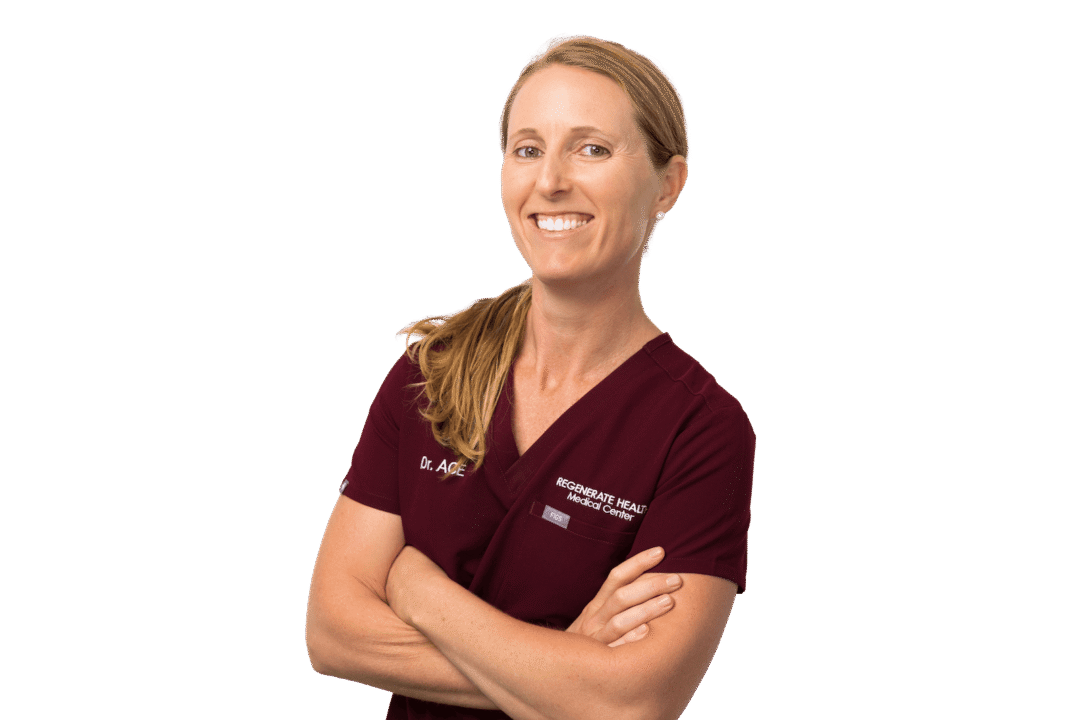 Female practitioner in burgundy scrubs smiling in professional horizontal portrait