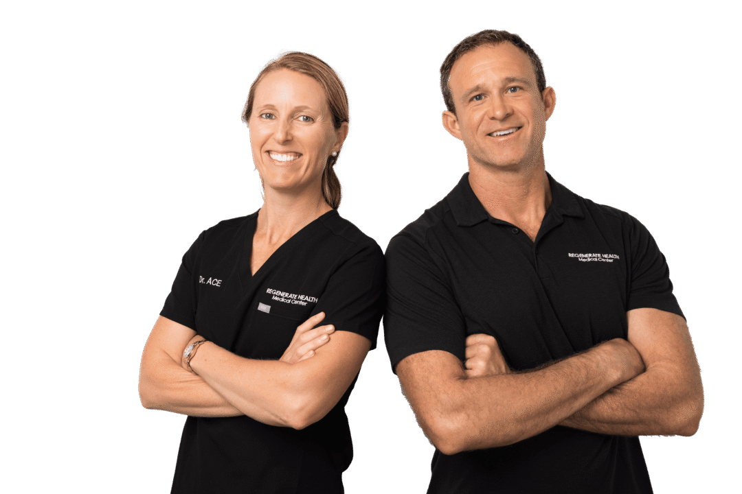 Two Regenerate Health Medical Center practitioners standing with arms crossed in professional team photo.