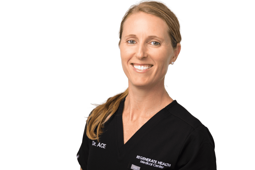 Female medical provider in black scrubs smiling in a horizontal professional staff portrait.