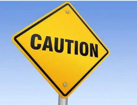 Yellow caution sign representing a conservative, cautious approach to GLP-1 medications